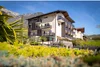 Collective enquiries © Alfred Tschager & Photography & Coaching Hotel Winzerhof with mountain backdrop and lush garden