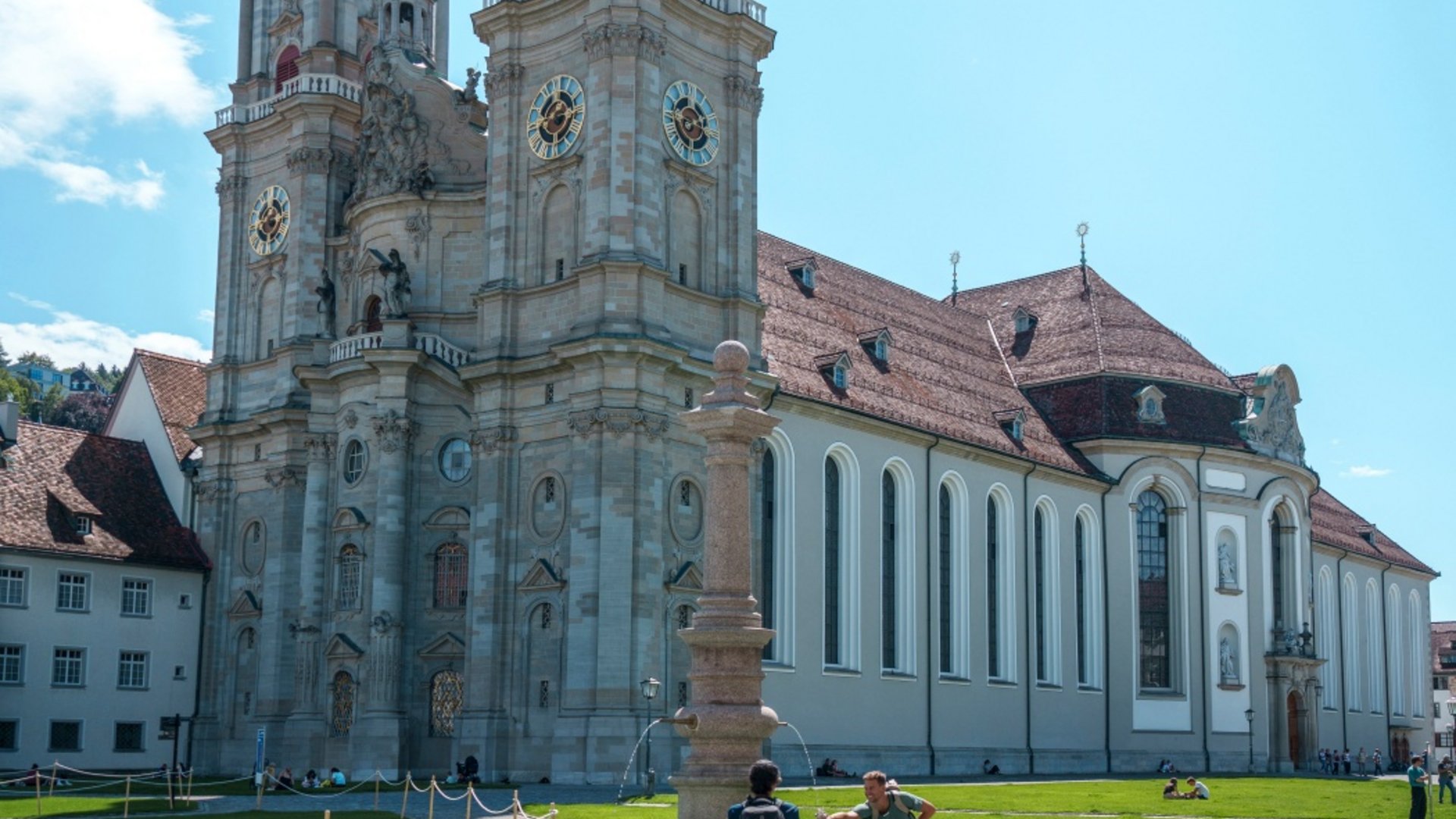Historic church with two towers and fountain in front