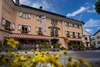 Collective enquiries Gasthof Steffner Wallner with yellow flowers in front under a blue sky