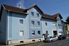 Collective enquiries © Gasthof & Gästehaus Trummer Blue guesthouse Trummer with cars parked outside on street