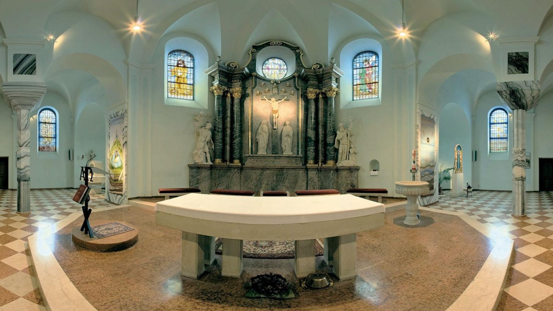 Interior of a church with altar and crucifixion artwork