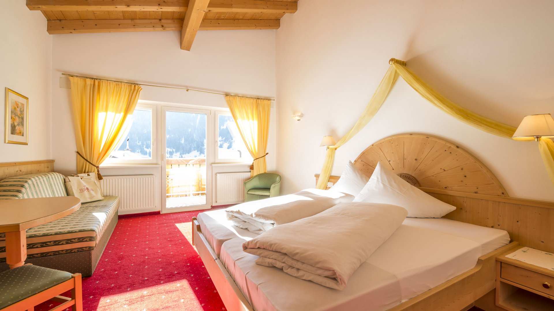 Cozy hotel room with wooden furniture and mountain view