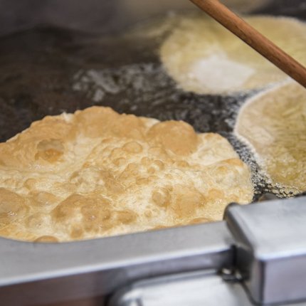 Dough frying in hot oil