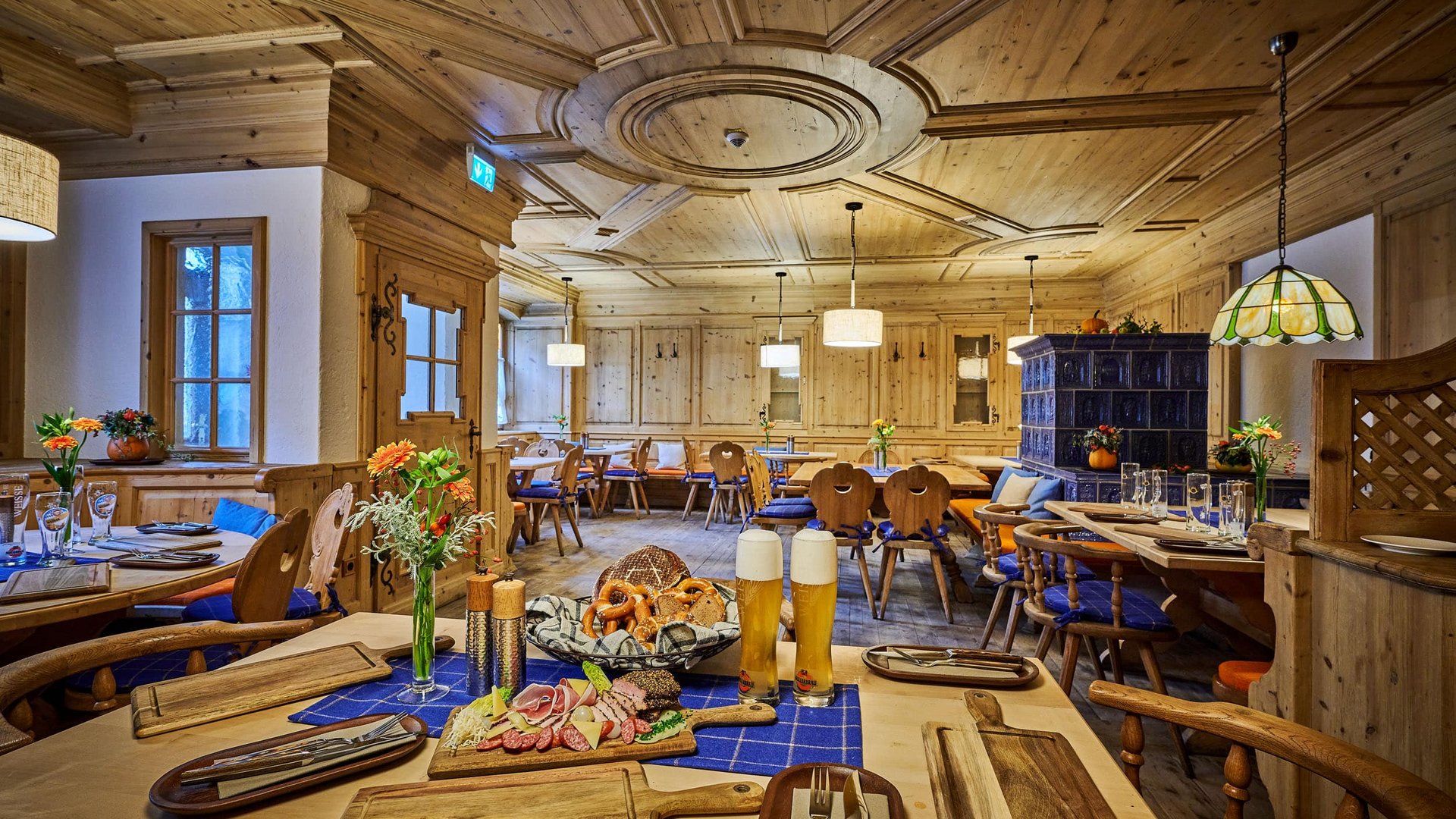 Cozy wooden restaurant with Bavarian decor and beer with snacks on the table