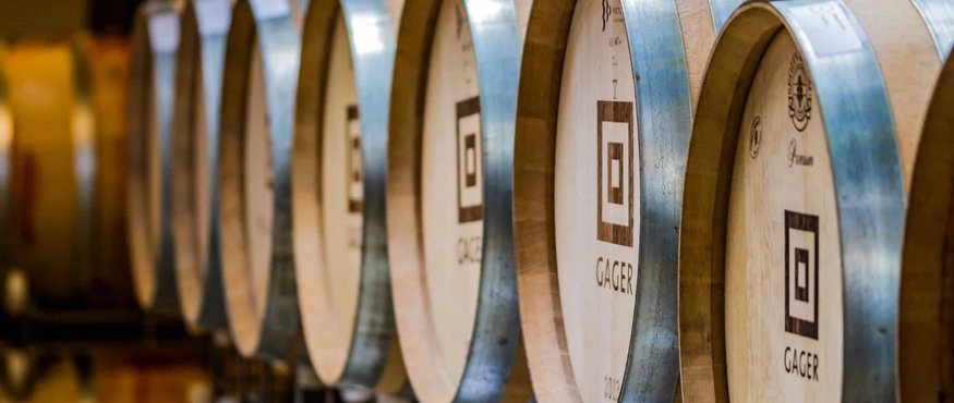 Row of wooden barrels in a warehouse