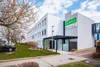 Collective enquiries Modern Flexy Motel building with parking spaces in front