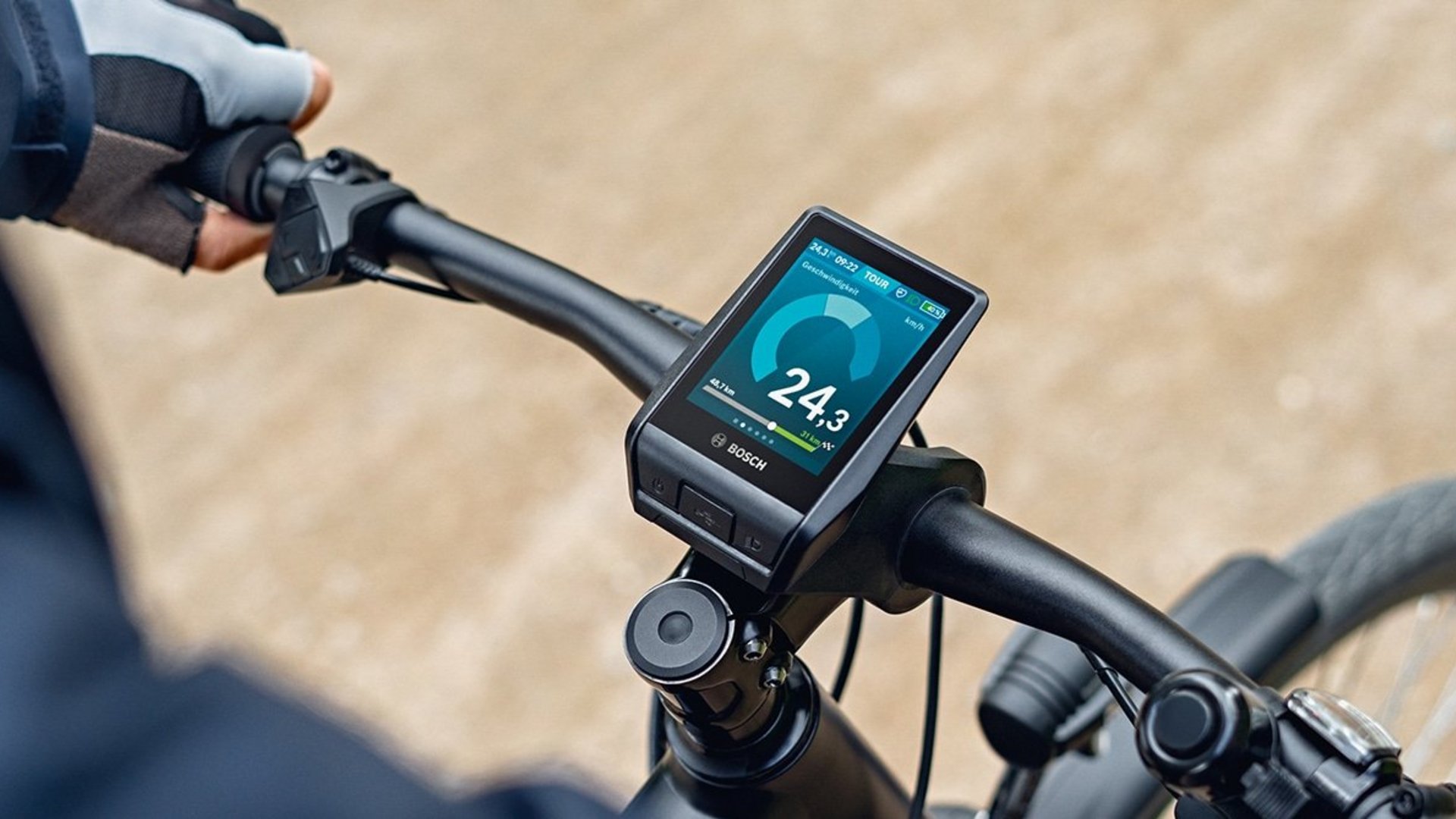 Bicycle handlebar with Bosch e-bike display showing speed 24.3 km/h