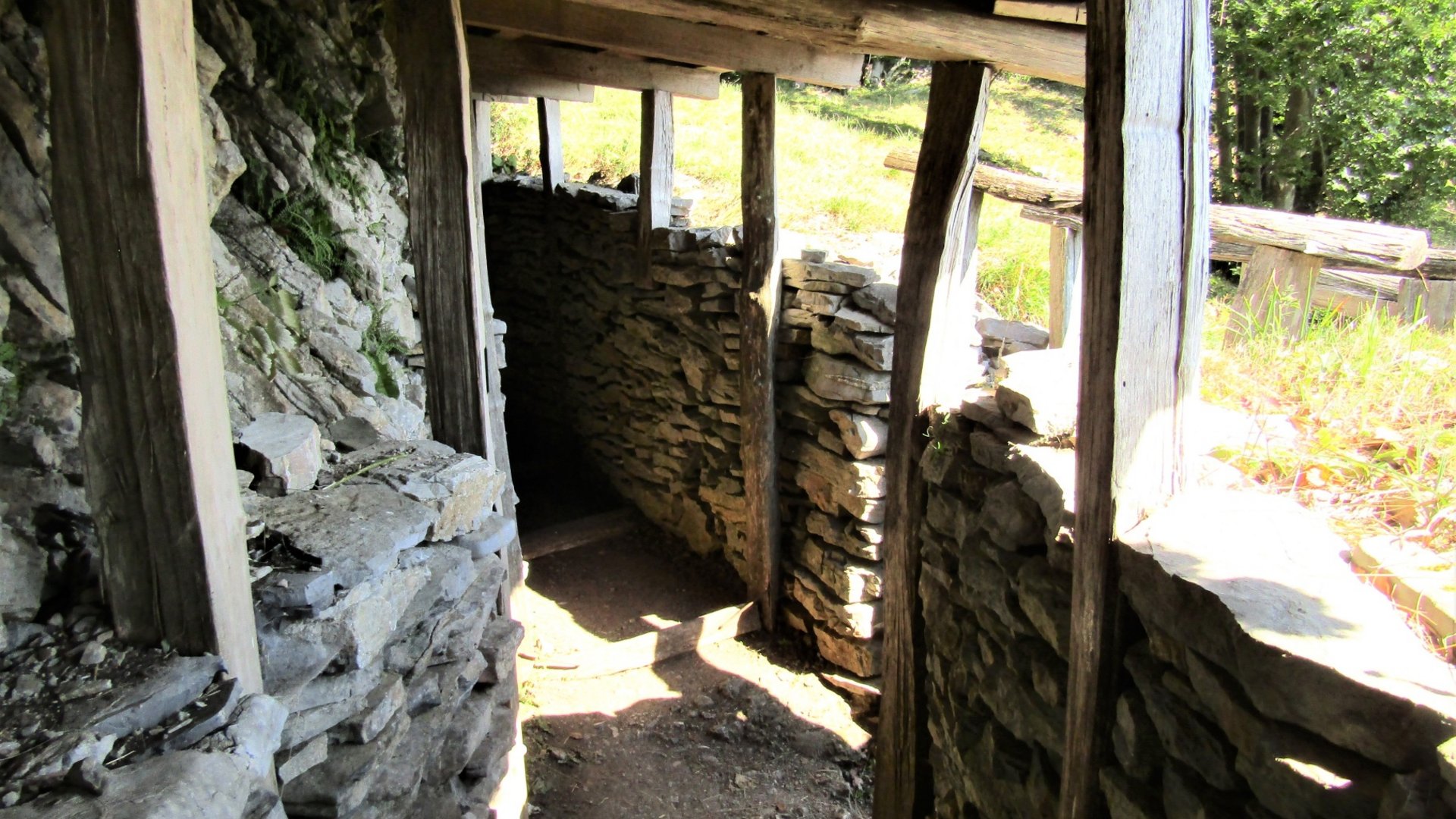 Stone trench with wooden roof under daylight