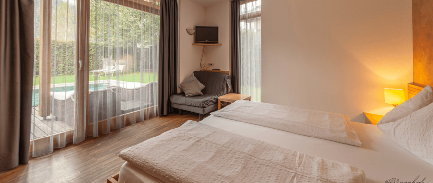Cozy hotel room with view of terrace and garden