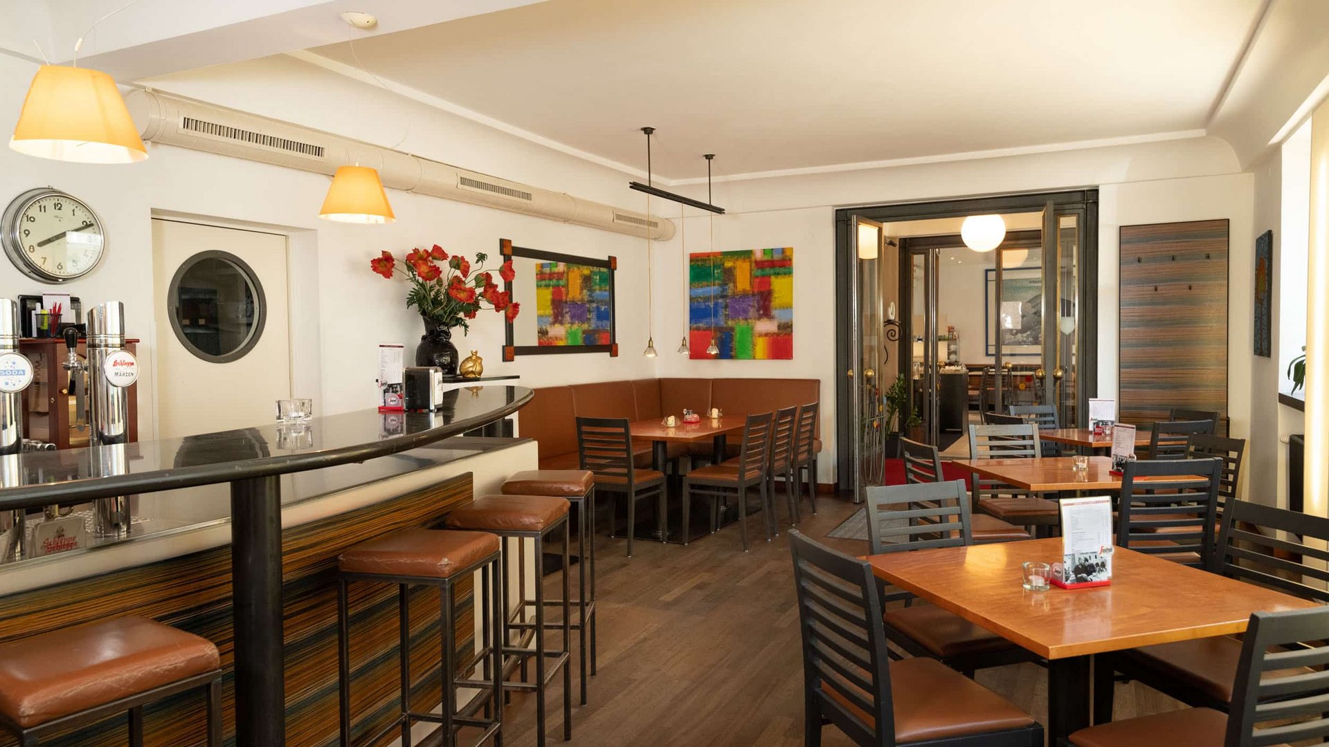 Empty cozy café with bar, tables, and modern decor