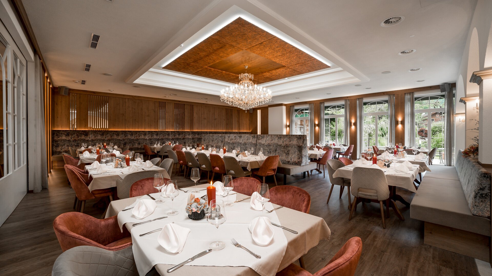 Elegant restaurant with set tables and chandelier