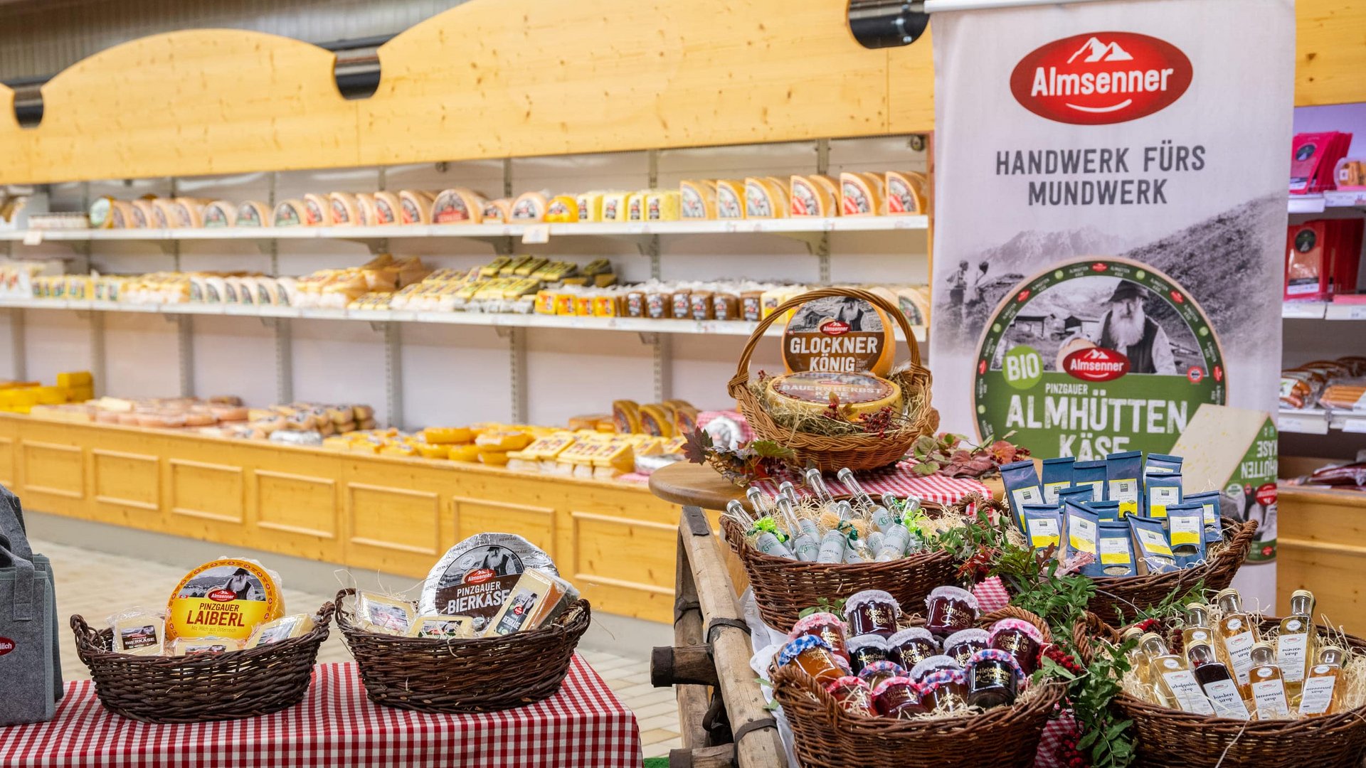 Cheese and local products in a store with Almsenner signage
