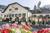 Collective enquiries Stafler hotel and restaurant in the mountains with flowers in front