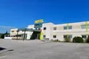 Collective enquiries Exterior view of Hotel Weinland with parking lot and clear blue sky