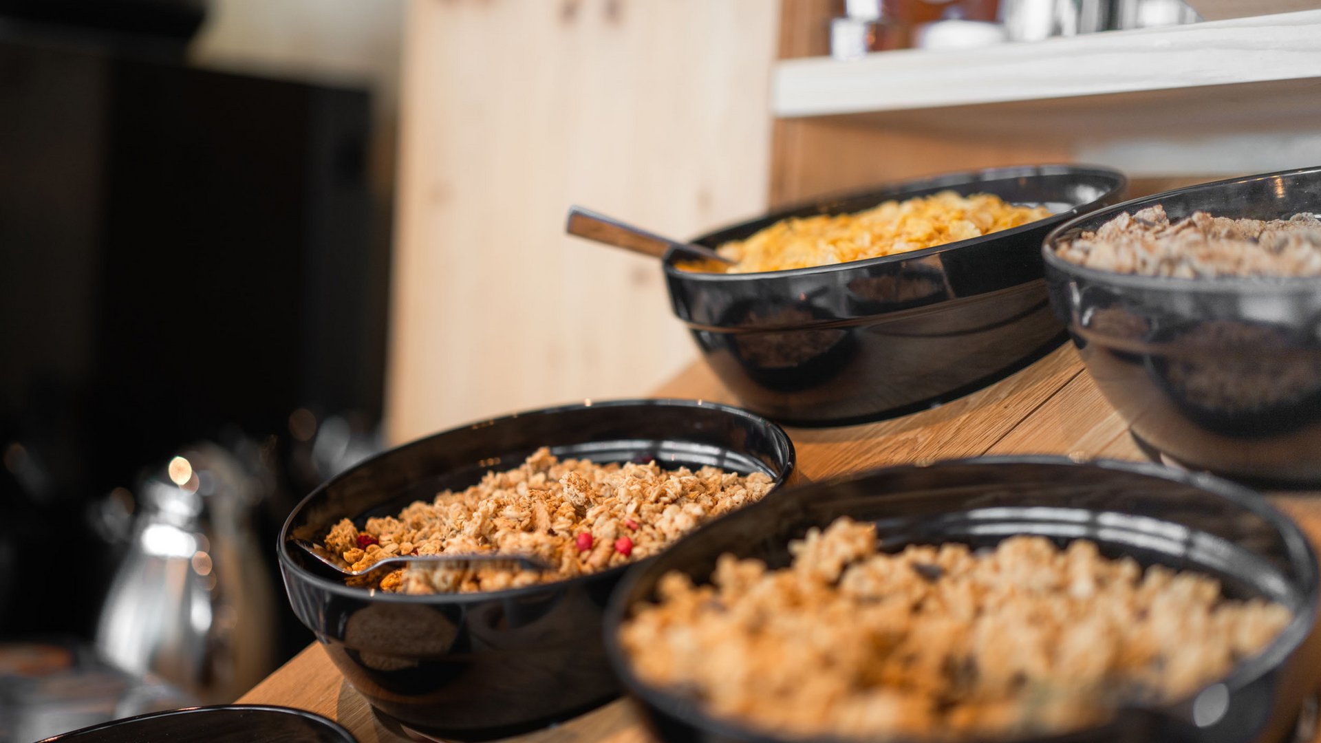 Bowls with different cereals on a buffet