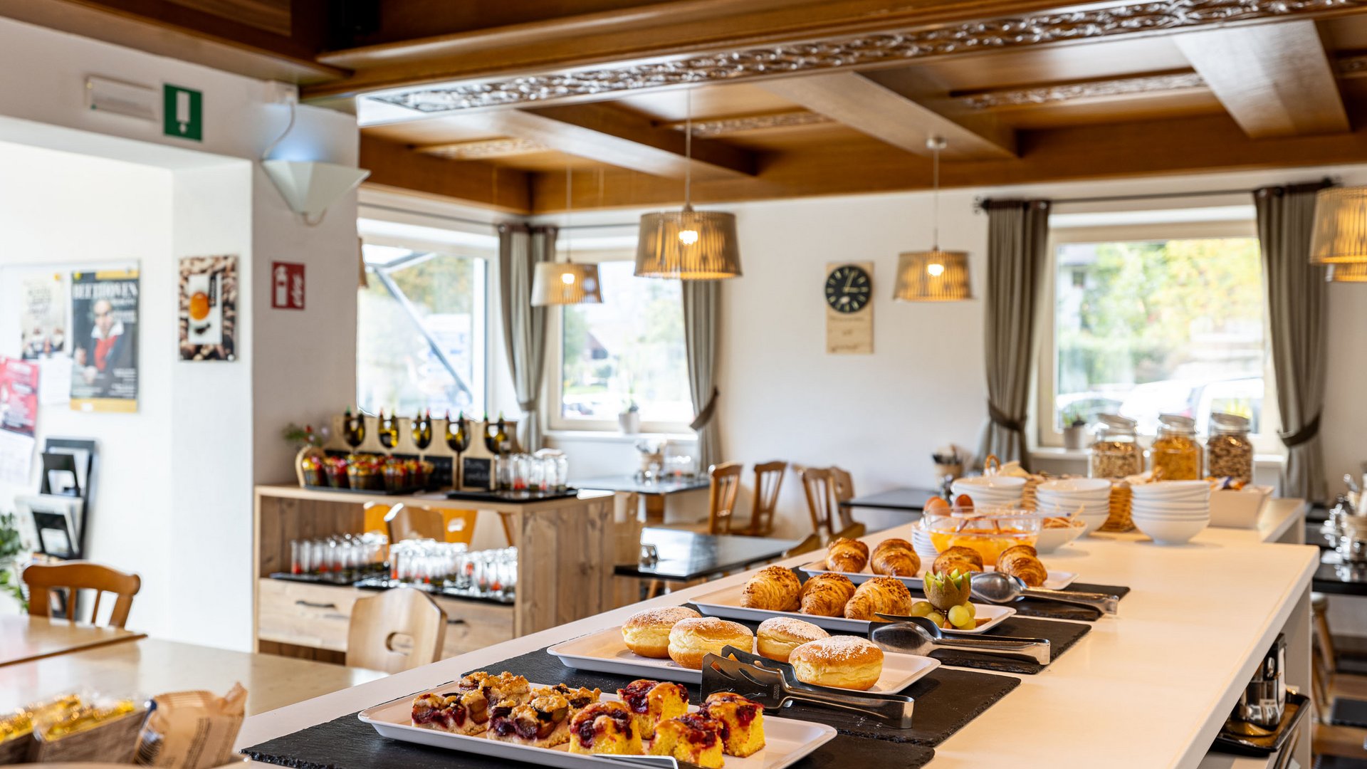 Breakfast buffet with pastries and croissants in a bright dining area