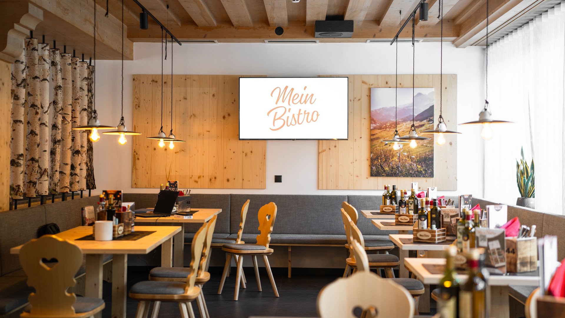 Cozy bistro with wooden furniture and modern lighting