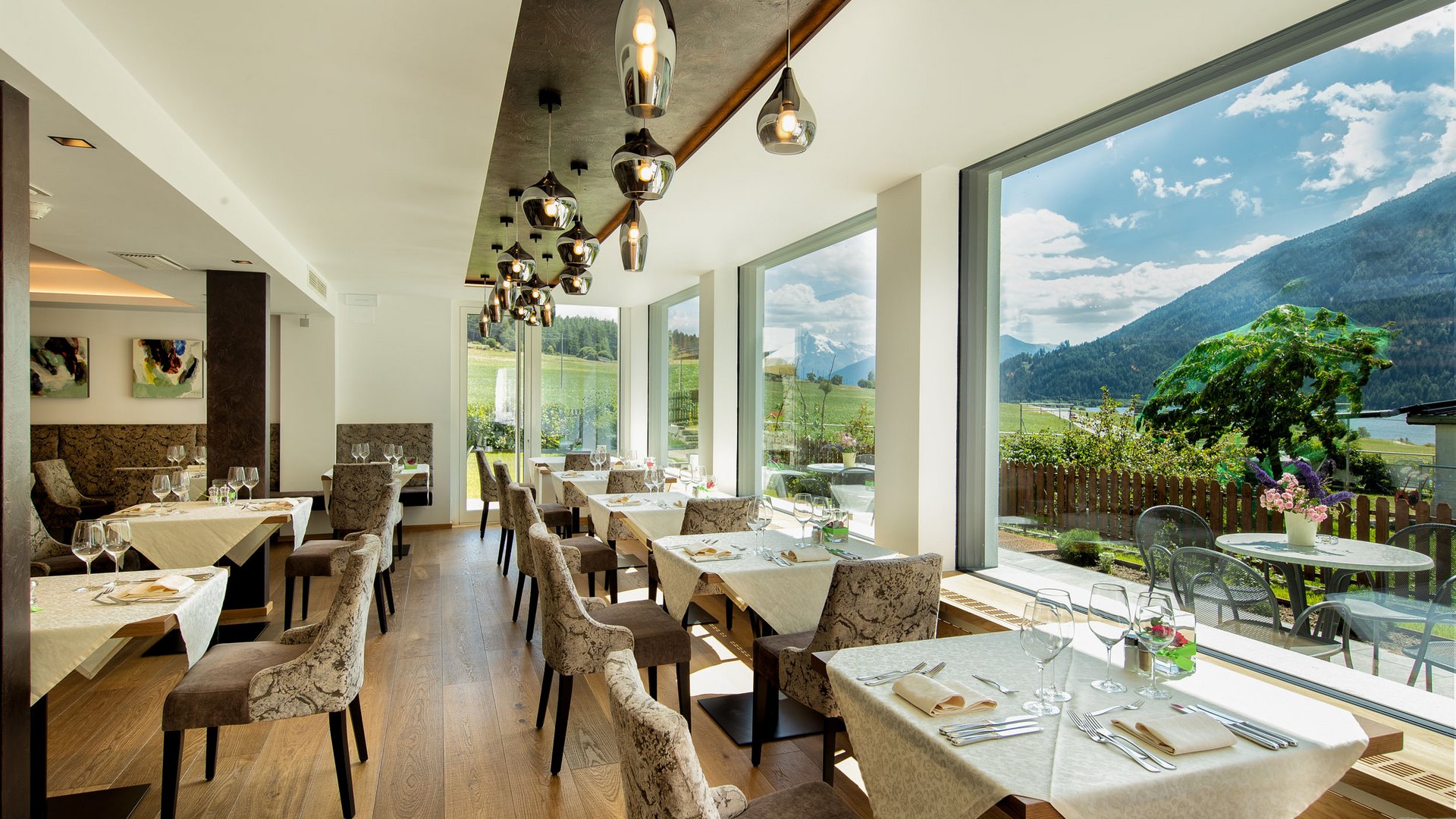 Modern restaurant with large windows and mountain view