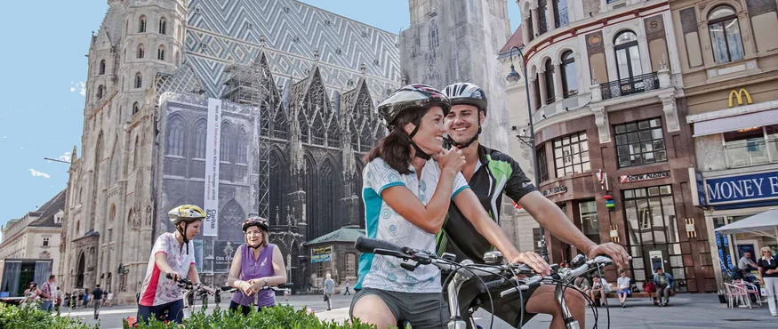 Cyclists resting near St. Stephen's Cathedral in Vienna