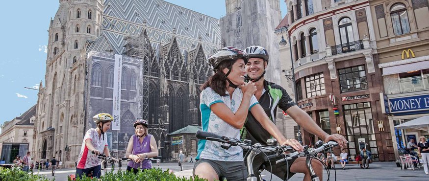 Cyclists resting near St. Stephen's Cathedral in Vienna