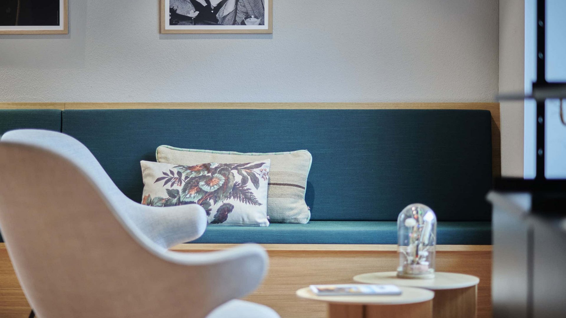 Modern seating area with blue sofa and comfortable armchair