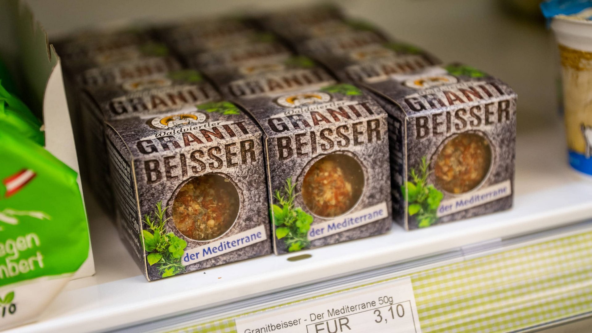 Multiple packs of Granitbeisser herb mix on store shelf