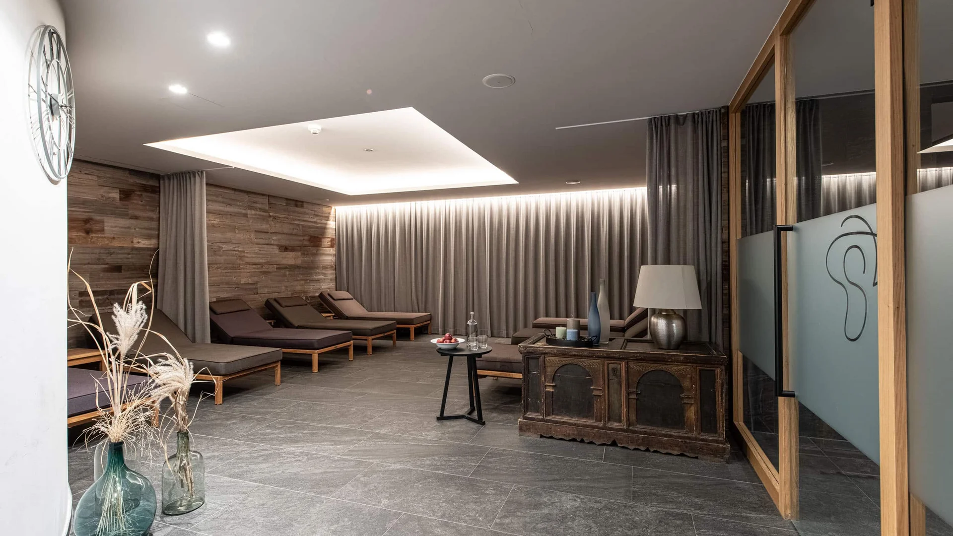 Modern relaxation room with lounge chairs and soft lighting