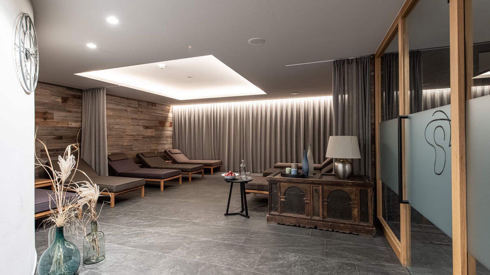 Modern relaxation room with lounge chairs and soft lighting