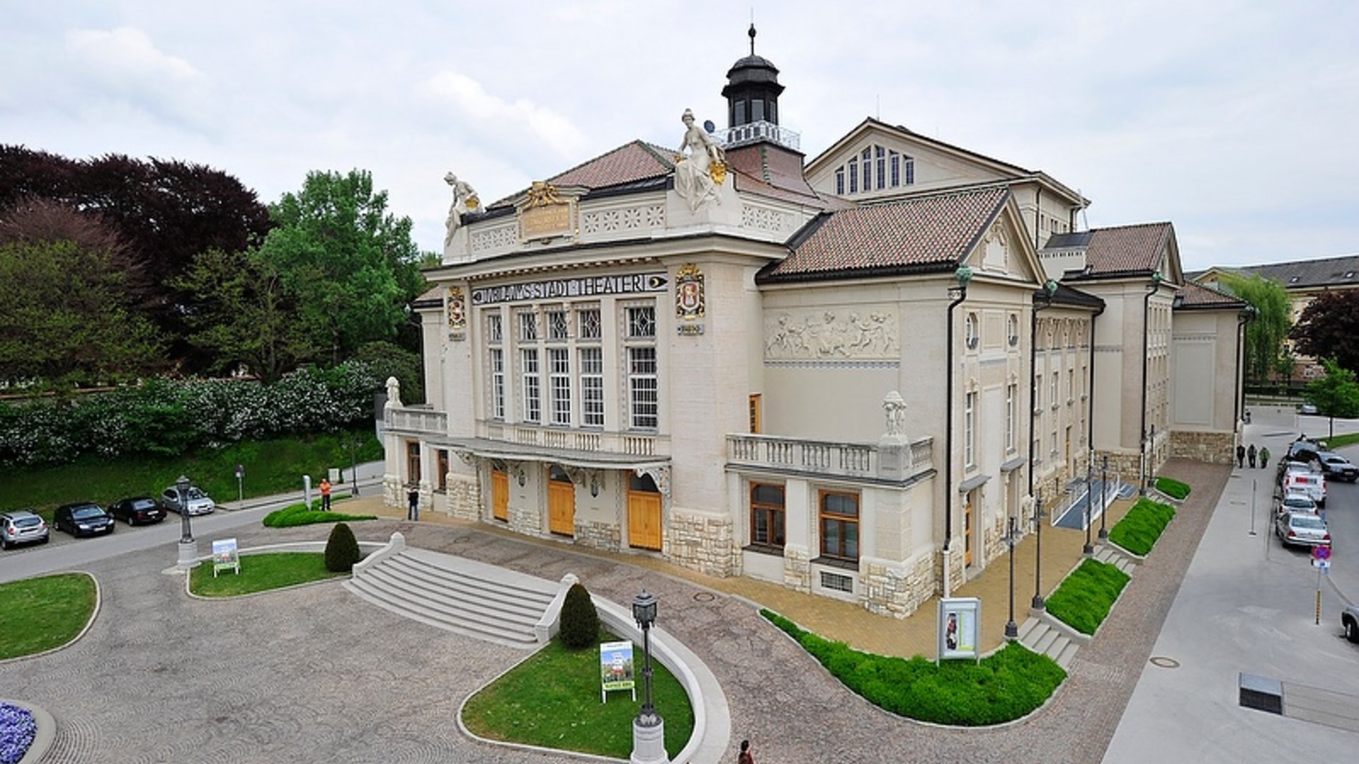 Exterior view of historic Völkermarkt city theater under cloudy sky