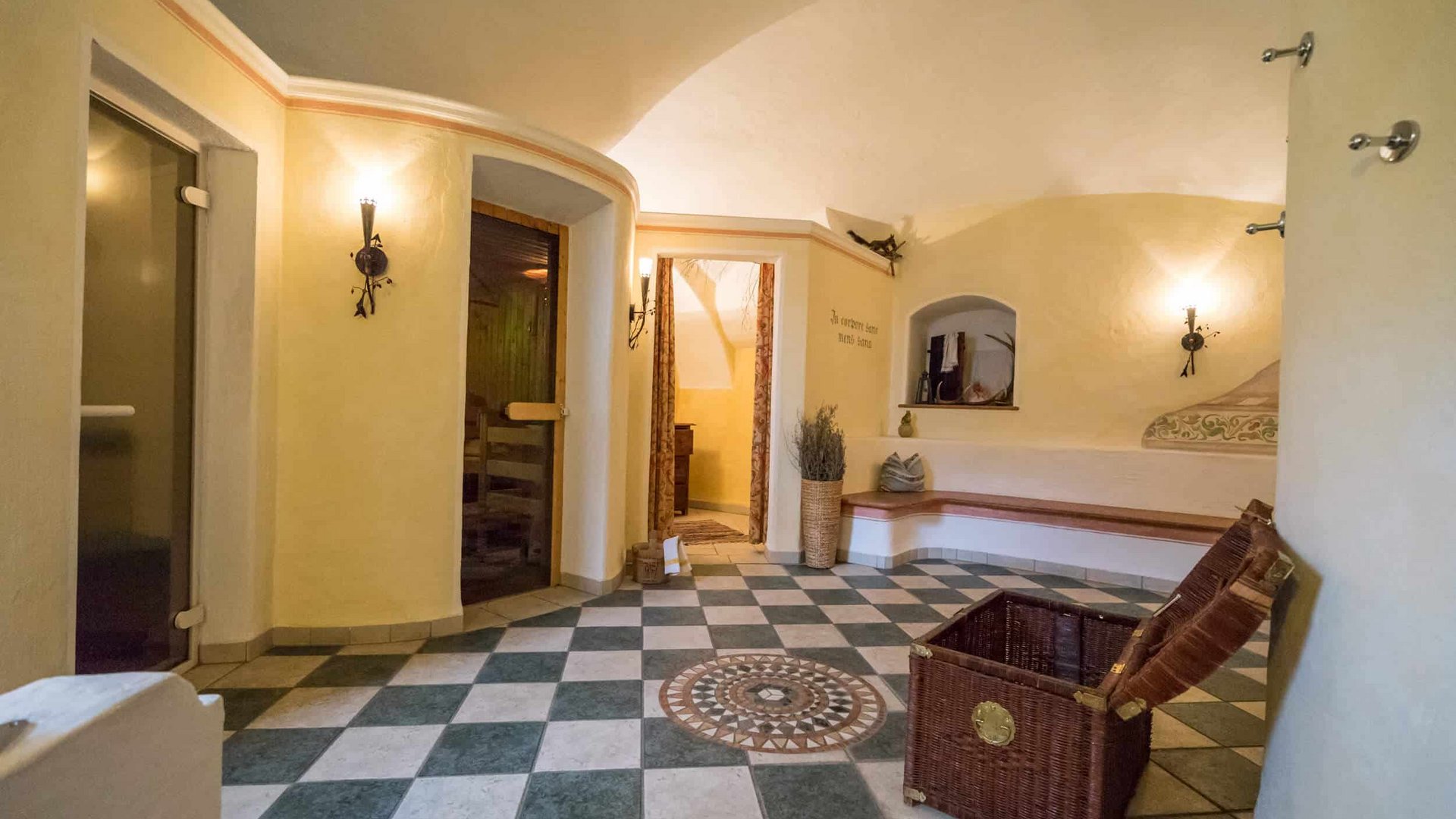 Bright room with patterned floor, basket, and seating area