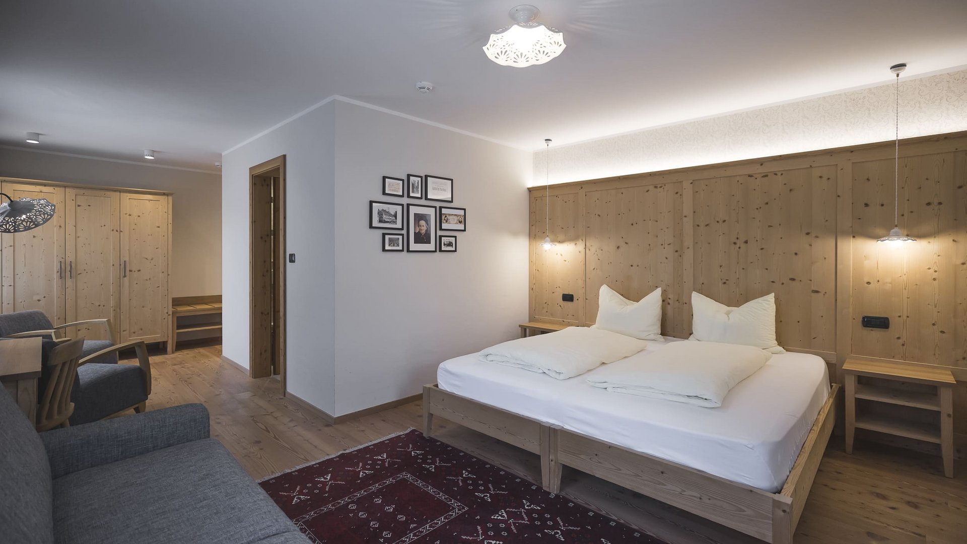 Cozy bedroom with wooden furniture and double bed