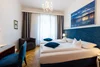 Collective enquiries © Lifepictures.at Modern hotel room with blue accents and double bed