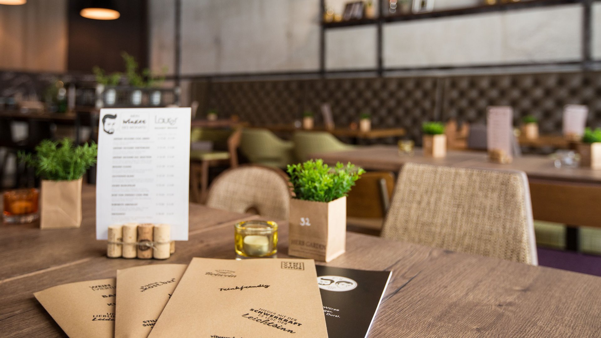 Menus on a wooden table in a cozy restaurant